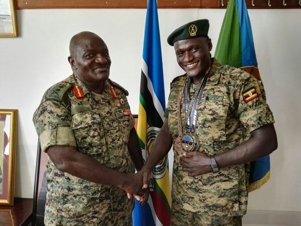 Tugume with former CDF, Gen. Katumba Wamala