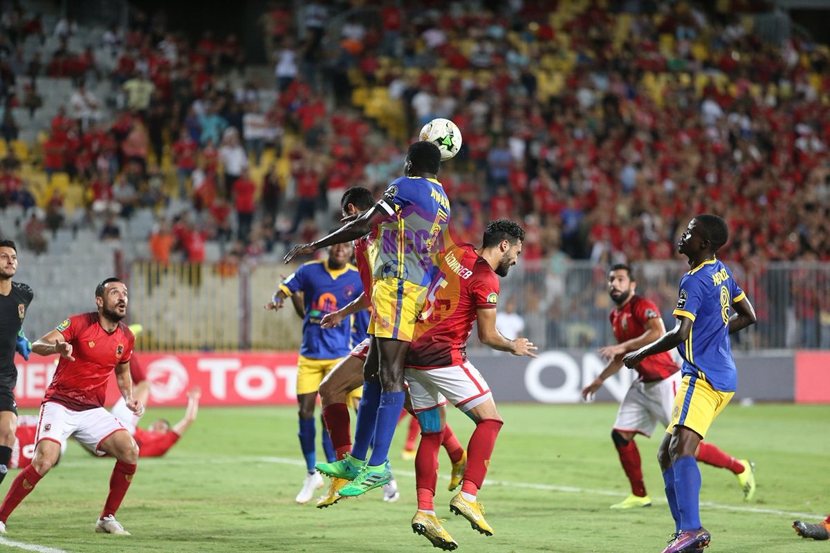 Timothy Awany out jumps Egyptian defenders during a set piece