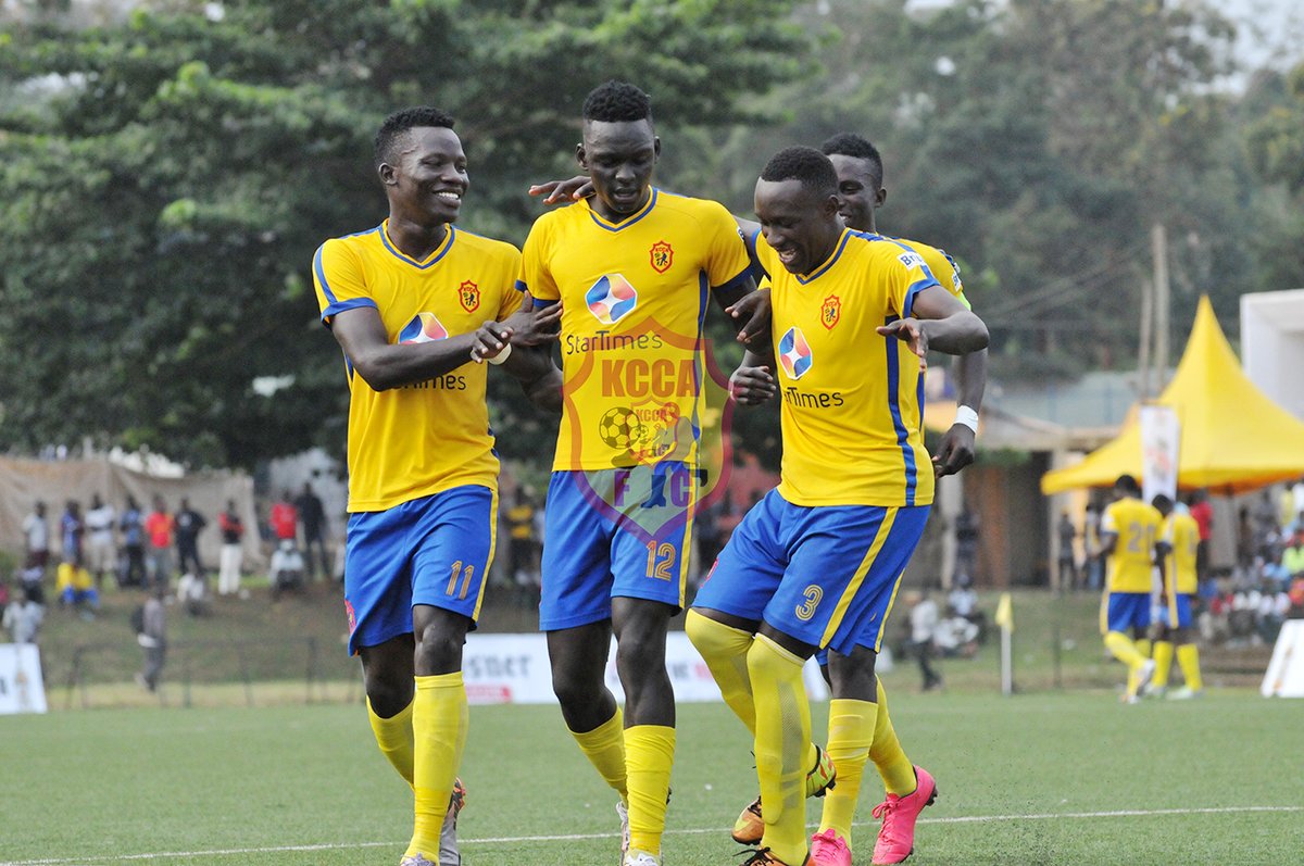 Kizza (centre) is congratulated by teammates after scoring from a free kick situation