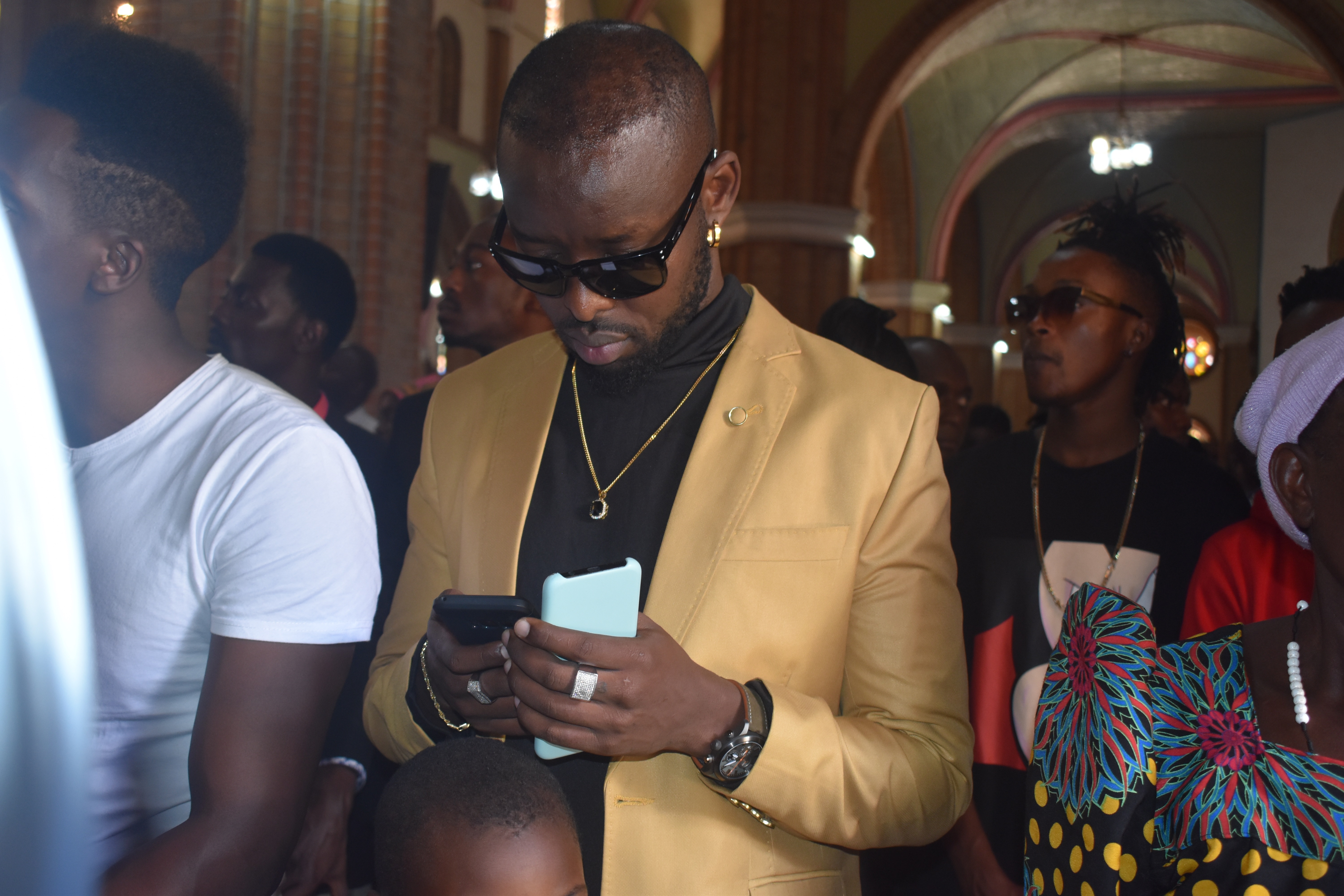 Eddy Kenzo clad in a cream suite was visibly among hundreds in the church