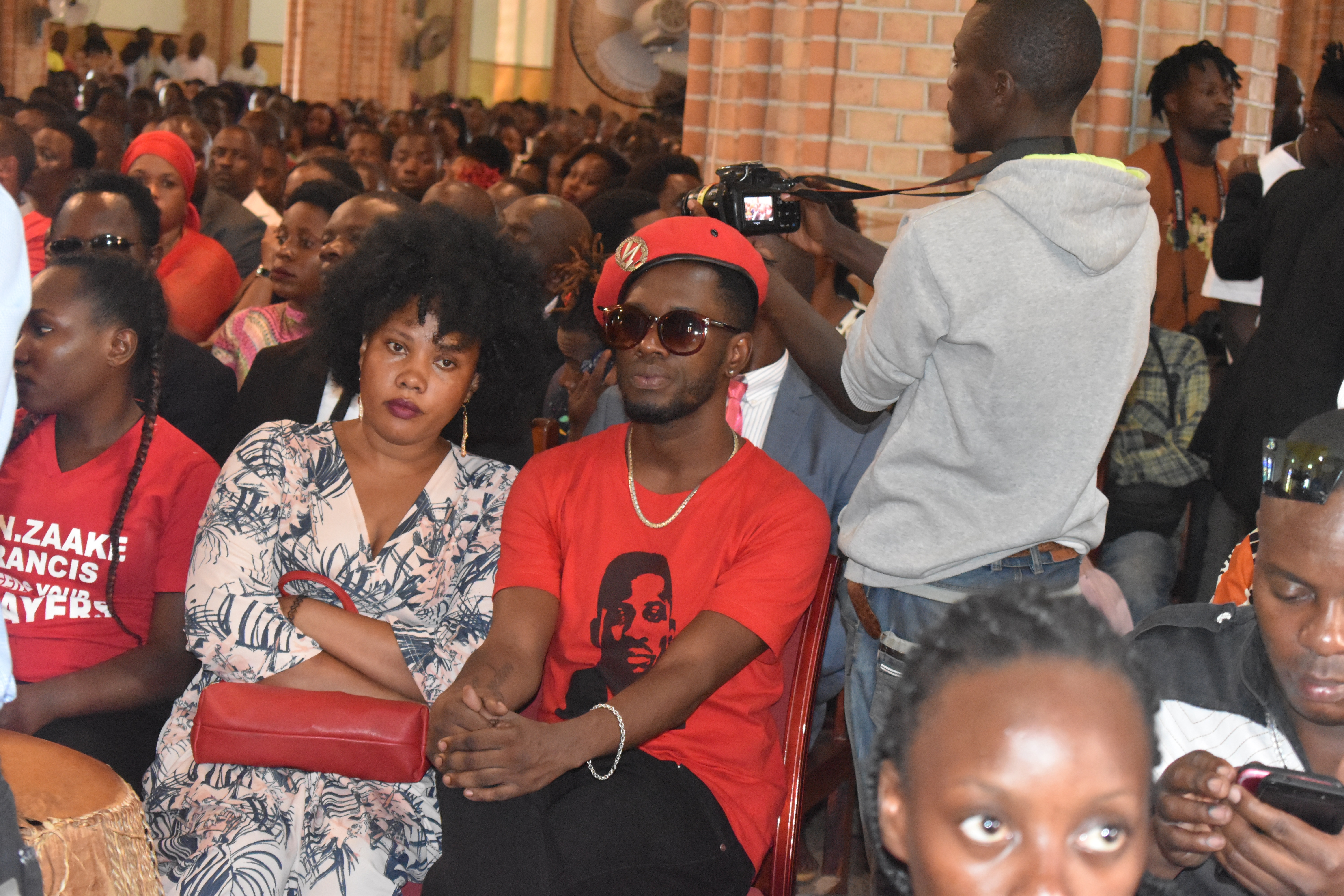 Bobi Wine's right hand man Nubian Lee donned a red t-shirt with a picture of his man and red top with his sweetheart by his side at the prayer service in Rubaga Cathedral