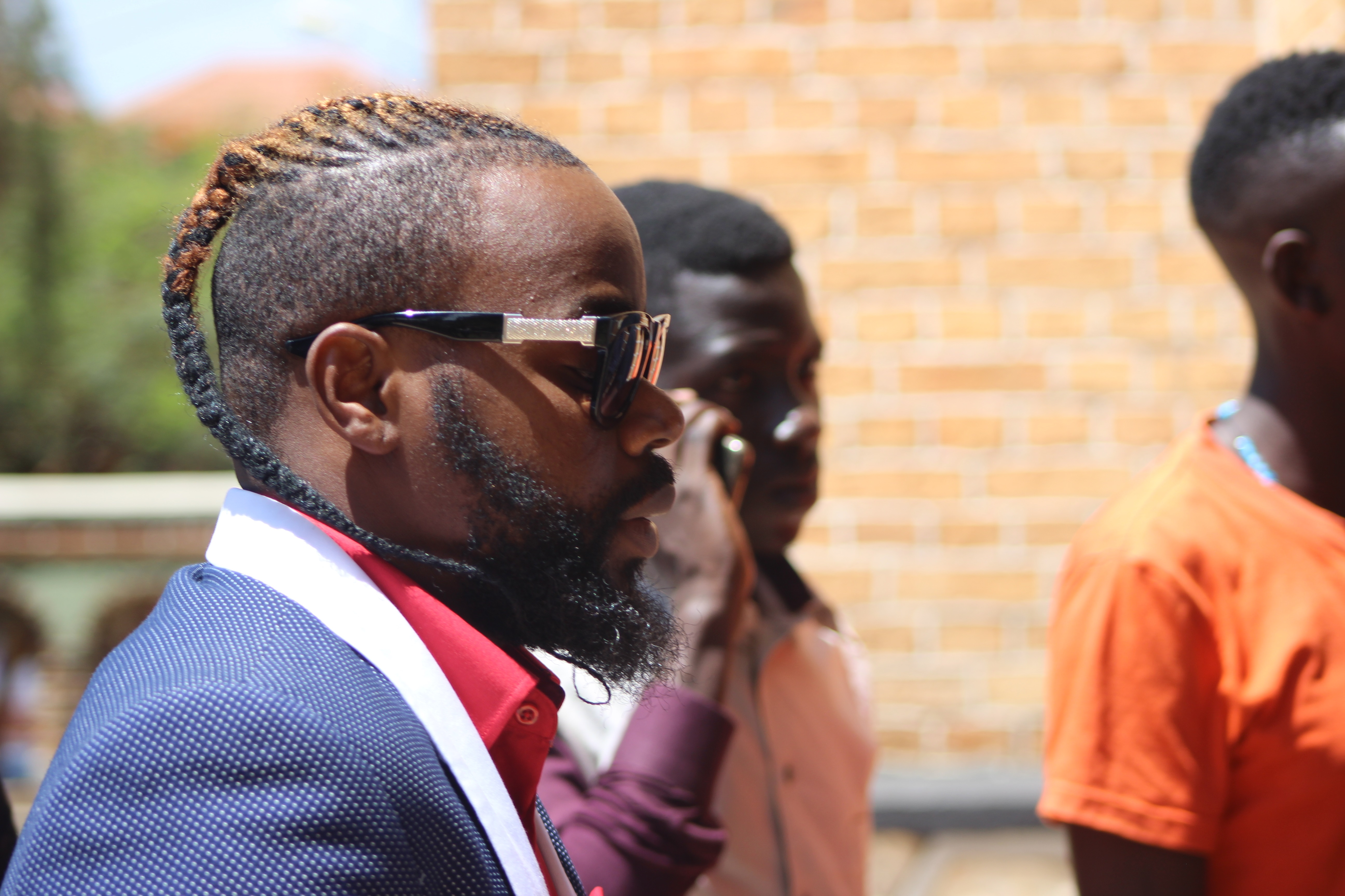 Singer Aziz Azion in blue suite was there to support Bobi Wine