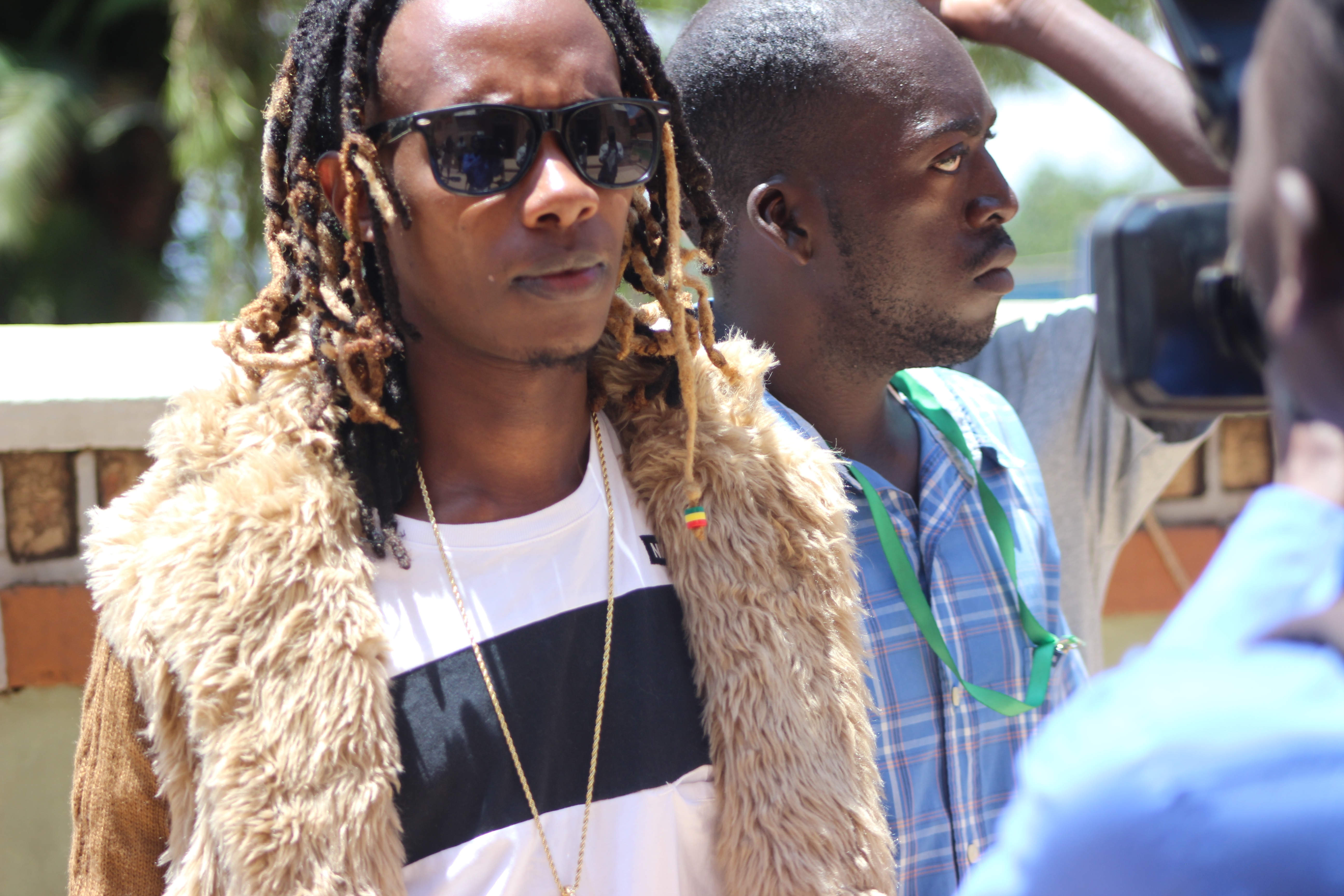 The smallest rapper Feffe Busi seen arriving at the Cathedral in Rubaga