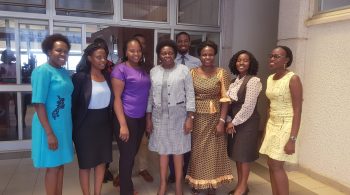 Minister Sarah Opendi (centre in grey suit) with Parliament media staff
