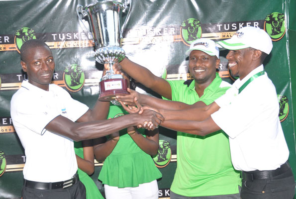 Kitata (L) is awarded by golf boss Kiryowa Kiwanuka (R) and UBL marketing manager Mark Mugisha