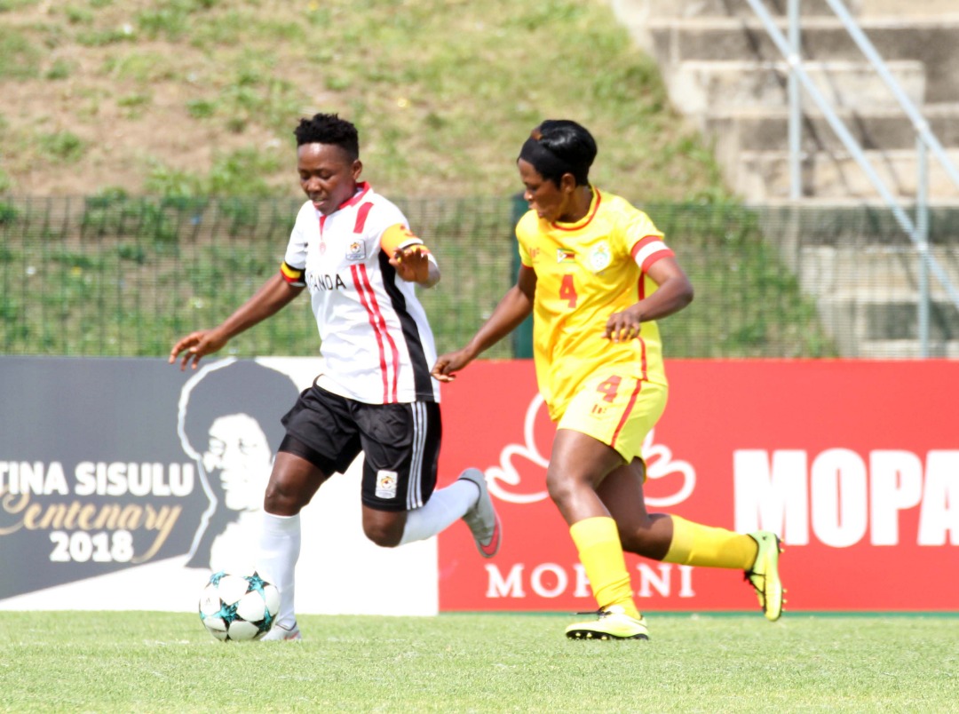 Crested Cranes captain Tracy Jones Akiror who scored the second goal, (L) enjoying control of the ball in the match against Zimbabwe in the COSAFA Women Championship.
