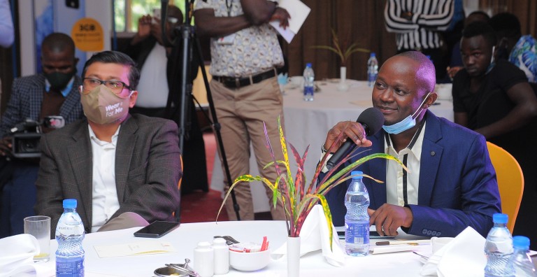MTN Ug CMO, Somdev Sen (L) with Tecno's Steven Ssemyalo (R) at the Camon 16 Launch at Serena Hotel