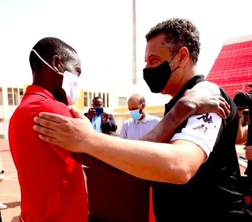 Morley Byekwaso embraces opposite opponent Maher Kanzari before kick off (Courtesy Photo)