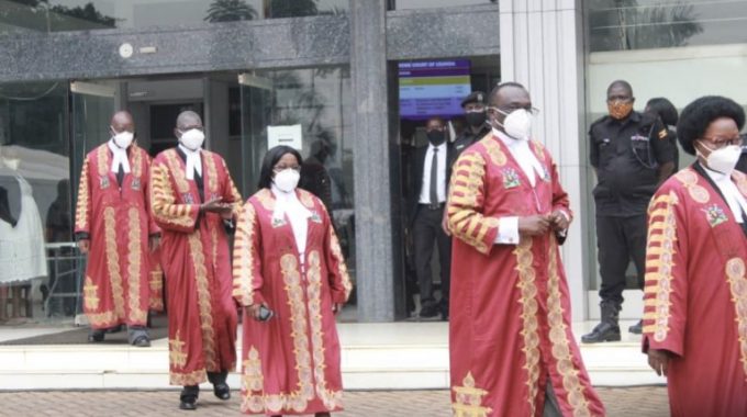 Chief Justice Owinnyi Dollo (second right) ordered election petition lead lawyer to be handed temporary certificate (Courtesy Photo)