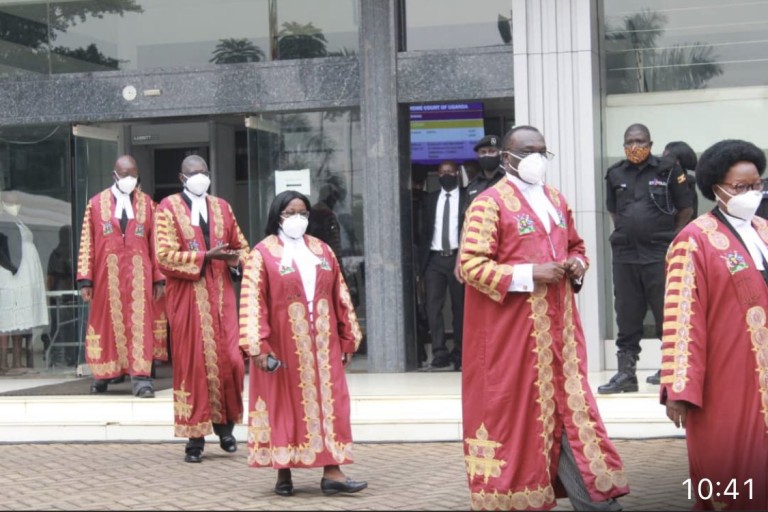 Chief Justice Owinnyi Dollo (second right) ordered election petition lead lawyer to be handed temporary certificate (Courtesy Photo)