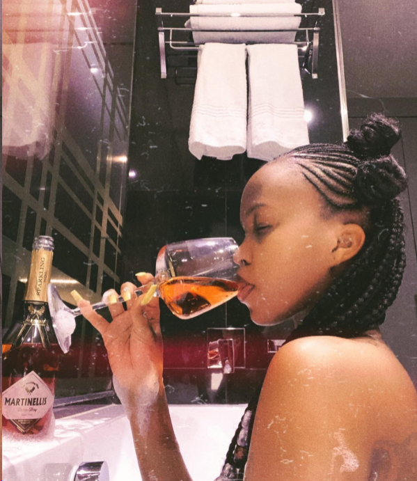 Sheilah Gashumba shares exclusive pics while cooling off as she sips on Martinelli in the bathtub