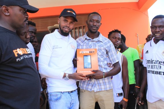 Muhangi hands over the first phone in Soroti